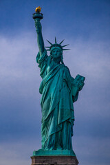 Fototapeta premium The Statue of Liberty against a blue sky at daytime