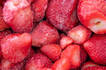 a bowl of fresh organic frozen strawberries used for smoothie