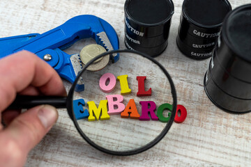 concept of barrel of oil with words sanctions, national flag and ruble in wise