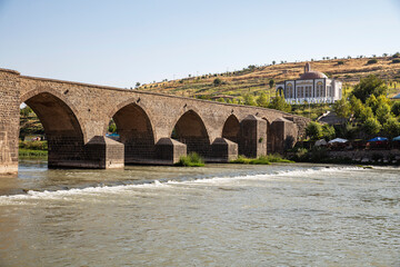 Historical Diyarbakır ten-eyed bridge and reflection of the Tigris river