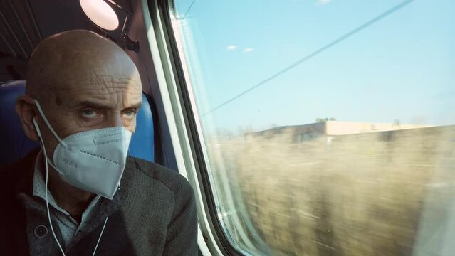 Old Man Looking Out The Train Window