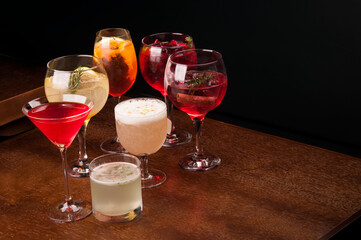 mixology assorted and colorful cocktails collection on wooden table