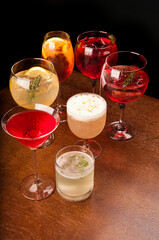 mixology assorted and colorful cocktails collection on wooden table