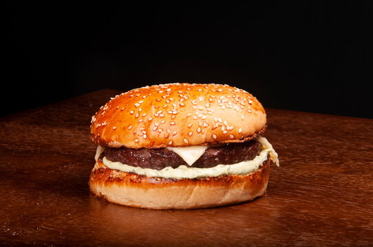 Simple Cheese Burger With Sesame Bun, Meat, Cheese And Mayonnaise