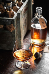 Tasty and noble brendy with ice in an old cellar.
