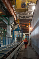 Fototapeta premium Workers in warehouse controlling transportation