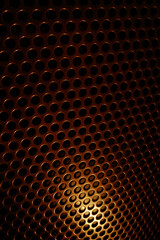 bronze shiny metal grille
 as an abstract background