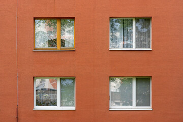 Obraz premium four white windows of an apartmnent house in Slovakia