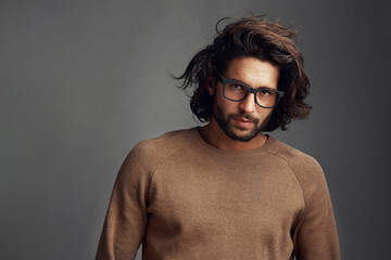 Put your life in focus. Studio shot of a handsome young man posing against a gray background.
