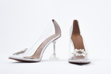 Transparent women's shoes with high heels. Shoes with crystals. Cinderella shoes. Side view