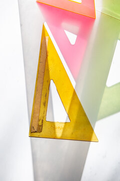 colored drafting triangles on white with shadows 2