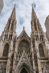Fototapeta na wymiar St. Patrick's Cathedral is the main attraction of New York City. The main entrance of St. Patrick's Cathedral. Gothic architecture in the United States