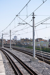 Fototapeta premium Electricity mast and energy cables of a train route. rail transportation,