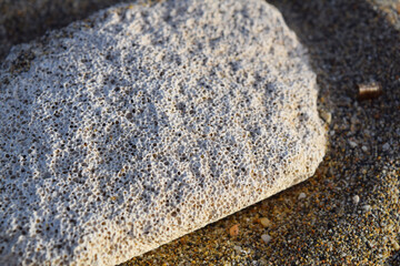 pumice stone on the sand