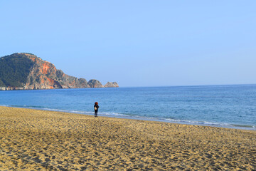 person walking on the beach