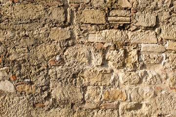 Stonewall background. The art texture of stone wall from stones. A backing with natural stones for branding, calendar, postcard, screensaver, wallpaper, poster, banner, cover, website