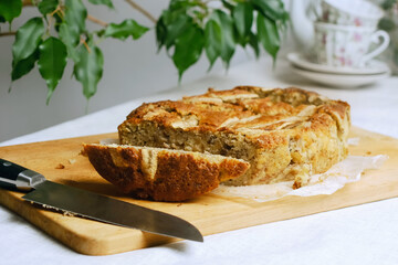 Loaf of banana bread cake on dining table.