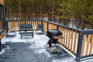 barbecue grill on the terrace of a country house in the forest