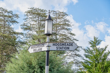 Fototapeta premium Sign pointing th Hogsmead village and station at Harry potter Islands of Adventure