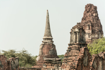 Fototapeta premium THAILAND Ruins and Antiques at the Ayutthaya Historical Park Tourists from around the world Buddha decay