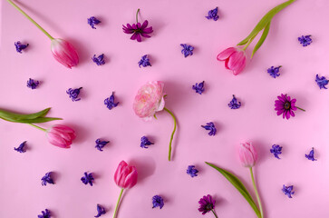 A lovely elegant spring or summer floral wallpaper or pattern made of pink tulips and violet...