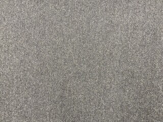 Grey tweed cloth texture, gray wool pattern. Textured fabric background of gray fabric. Grey wool textile.