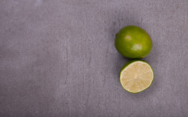 fresh sliced ​​lemon on top of gray stone top view