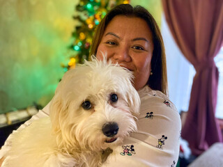 Portrait of a woman with a cavapoo dog