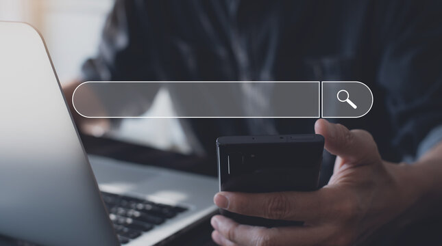 Data Search Technology Search Engine Optimization SEO. Man hand using mobile phone and laptop computer searching information