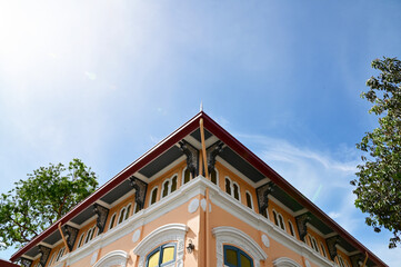 Part of the Roof of a temple in Thailand. Traditional Thai style pattern on the roof of a temple with Blue Sky Background.