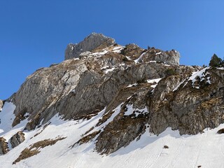 Rocky peak Dejenstogg or Dejenstock (2022 m) in the Glarus Alps mountain range, over the Kl&ouml;ntalersee (or Kloentalersee) reservoir lake and Kl&ouml;ntal alpine valley - Canton of Glarus, Switzerland