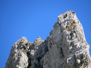 Rocky peak Dejenstogg or Dejenstock (2022 m) in the Glarus Alps mountain range, over the Klöntalersee (or Kloentalersee) reservoir lake and Klöntal alpine valley - Canton of Glarus, Switzerland