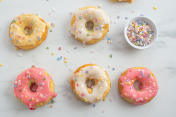 delicious sweet round donuts with colored sprinkles