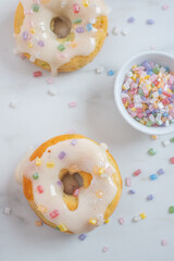 delicious sweet round donuts with colored sprinkles