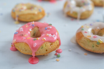 delicious sweet round donuts with colored sprinkles