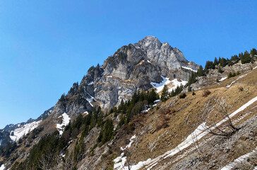 Fototapeta na wymiar Rocky peak Mättlistock (Maettlistock or Mattlistock, 1911 m) in the Glarus Alps mountain range, over the Klöntalersee reservoir lake and Klöntal alpine valley - Canton of Glarus, Switzerland (Schweiz)