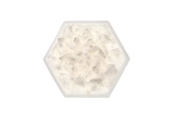 Flake salt in hexagonal molecular shaped container on white background.