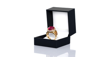 Burma Ruby with orange sapphires  and white quartz ring in black jewel box. Collection of natural gemstones accessories. Studio shot