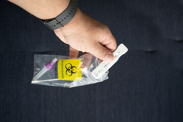 Human hand putting a negative antigen test