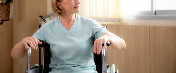 Patient elderly sitting wheelchair with stress and worry at the hospital,  disability and...