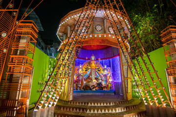 KOLKATA , INDIA - OCTOBER 18, 2015 : Night image of decorated Durga Puja pandal, shot at colored light, at Kolkata, West Bengal, India. Durga Puja is biggest religious festival of Hinduism.