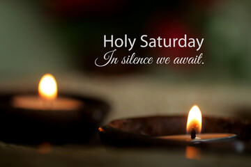 Holy Saturday concept with candle light in a traditional ceramic bowl and text quote - In silence we await. Happy Holy Saturday, the holy week before Easter.