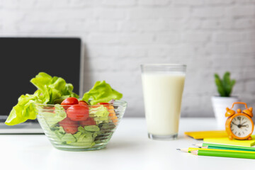 Healthy snack with working in office.  Green apple and fresh water for diet Health Planning, laptop work background.  Healthy Lifestyle Concept