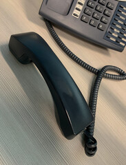 Business telephone with handset off the hook. - obrazy, fototapety, plakaty