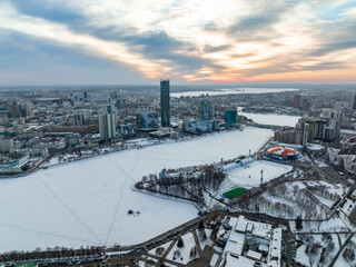 Yekaterinburg aerial panoramic view in Winter at sunset. Yekaterinburg city and pond in winter.