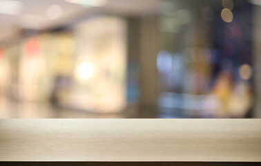 Empty wooden table in front of abstract blurred background of coffee shop . can be used for display or montage your products.Mock up for display of product