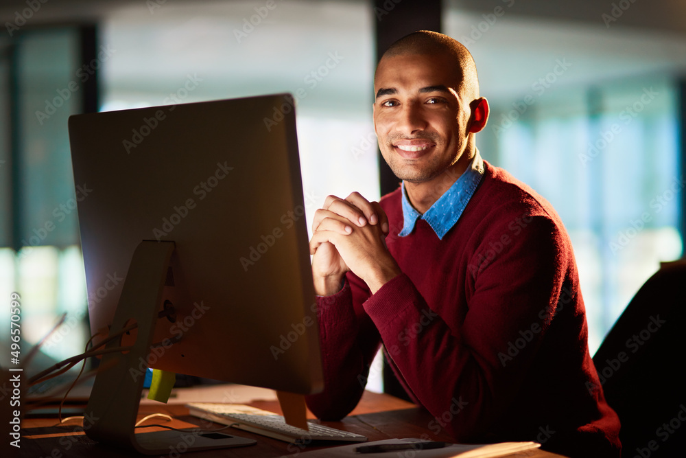 Poster I have no trouble working late. Portrait of a handsome young man working late in his office.