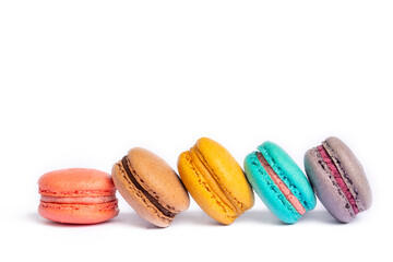 Colorful macaroon cakes. Small french muffins. Colorful macarons on a white background