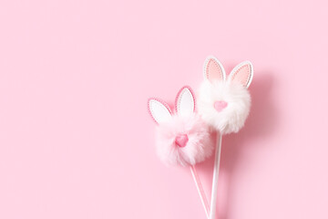 Fluffy easter decoration rabbit, easter creative concept on pink background