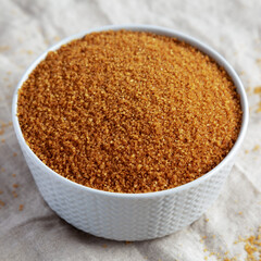 Brown Demerara Sugar in a Bowl, side view.